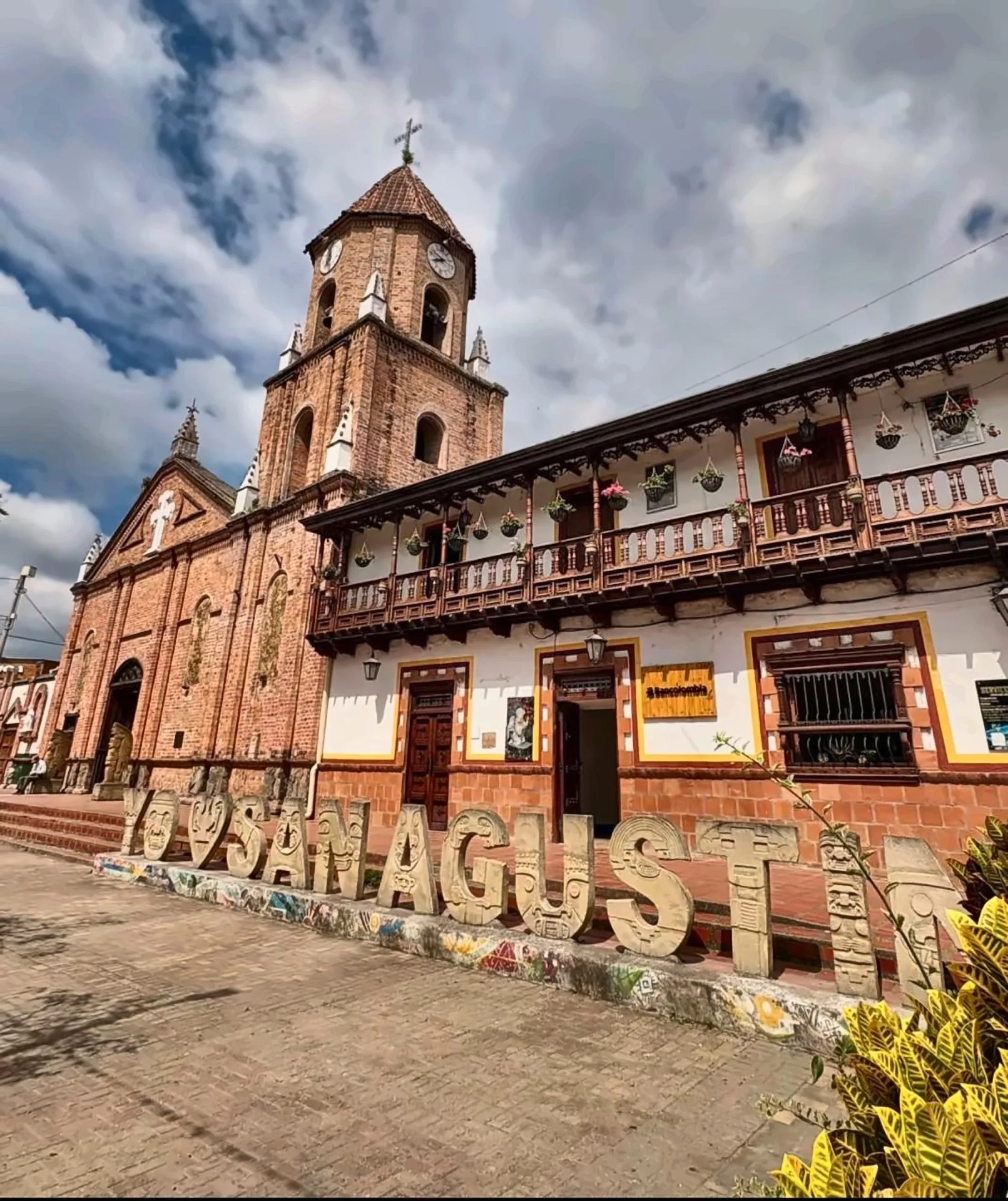 Church and carved «I love San Agustín» letters on the main square of San Agustín, Huila